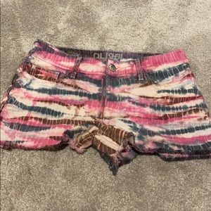 DL1961 tie dye raw edge denim shorts.